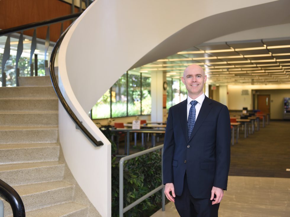 Interim President Storm standing in Swirbul Library