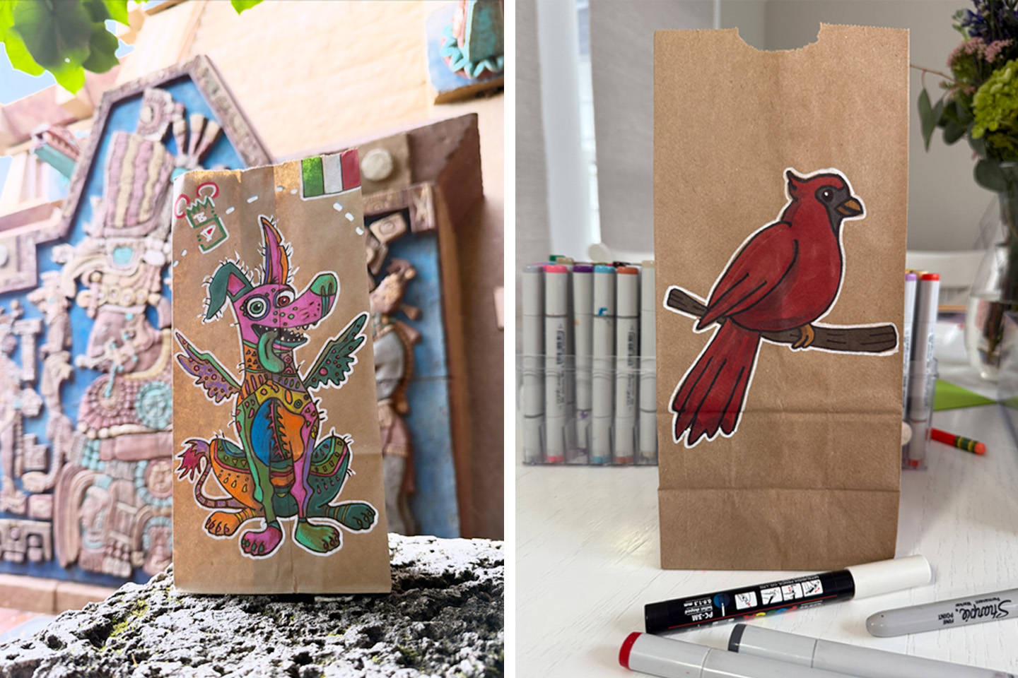 A split image showing two decorated brown paper lunch bags. The bag on the left features a brightly colored, hand-drawn illustration of Dante, the Xolo dog from the Pixar film Coco, in his Alebrije spirit-guide form, placed on an outdoor stone wall with a Mayan-inspired carving behind it. The bag on the right features a hand-drawn illustration of a red cardinal perched on a branch, displayed indoors on a table with an assortment of markers nearby.