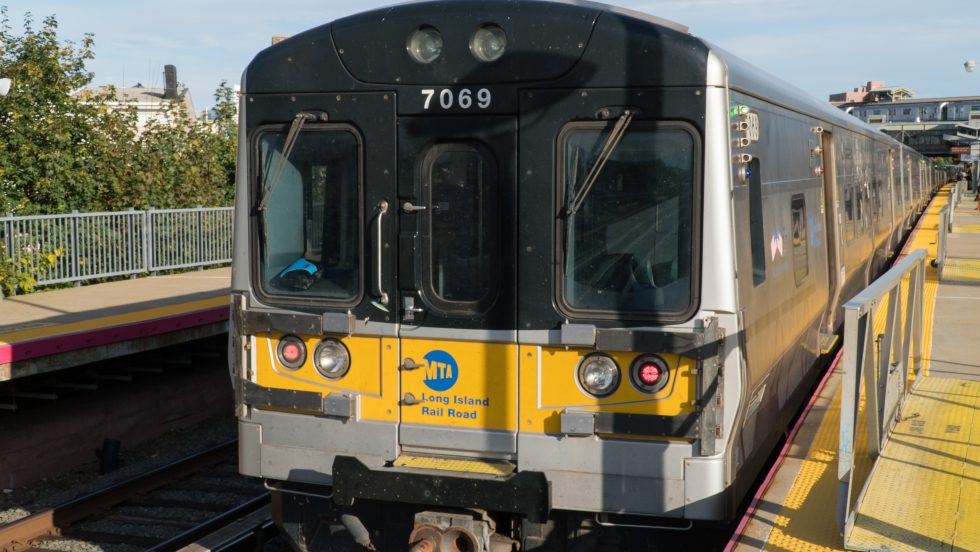 A view of an LIRR Train with MTA logo visible.