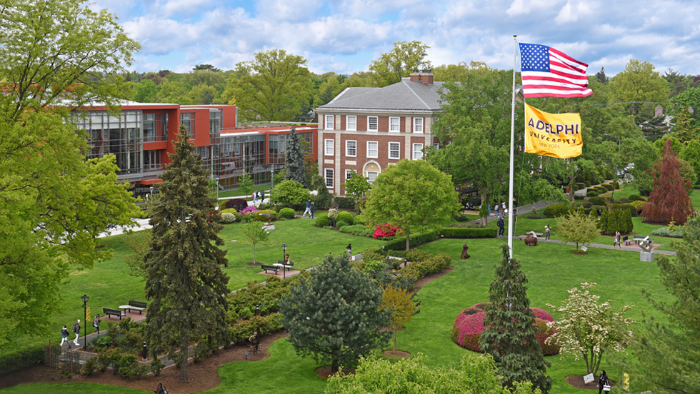 Flags fly alongside several landmark buildings on the Garden City campus.