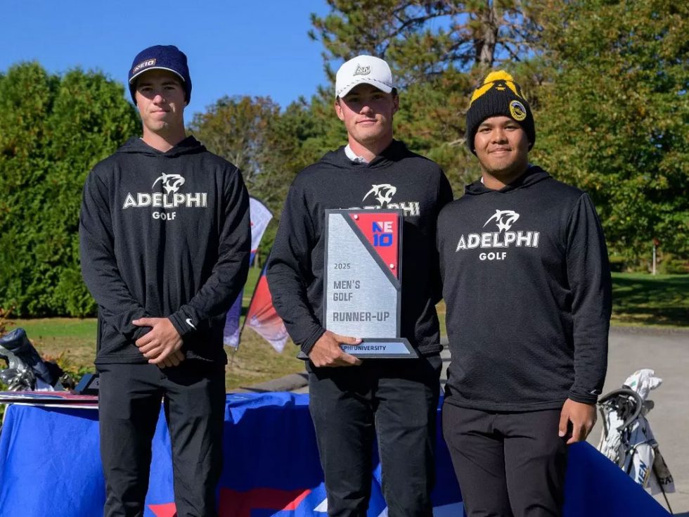 three men in Adelphi gold hoodies
