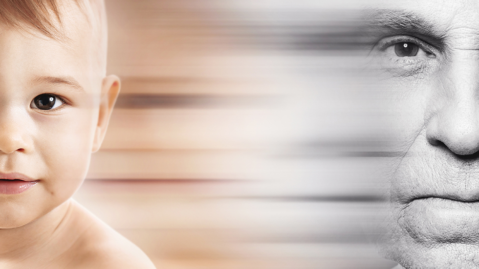 A composite image where the left side shows the face of a baby in color, and the right side shows a grayscale, close-up of an older person's face. A horizontal blur effect connects the two faces in the center.