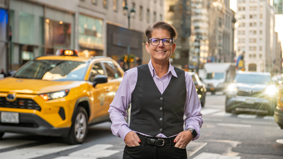 Jennifer Lancaster stands on a crosswalk on Fifth Avenue, just up the street from the new Manhattan Center.