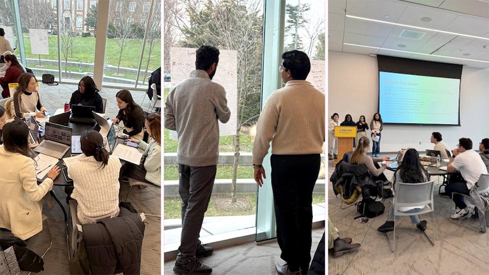 A collage of three photos showcasing students engaged in collaborative academic activities in a modern university setting. Left photo: A group of five female students sits around a circular table in a bright room with large floor-to-ceiling windows. They are focused on their laptops and notebooks, appearing to be in a deep group discussion. Middle photo: Two male students stand by a window, facing a white board or large paper sheet covered in diagrams and notes. They are actively reviewing their work with a view of a campus lawn and trees in the background. Right photo: A group of students delivers a presentation in a classroom. Four students stand at the front near an Adelphi University podium, while a slide titled "About LifeTime Brands" is projected onto a large screen. Several other students sit at a round table in the foreground, watching the presentation.