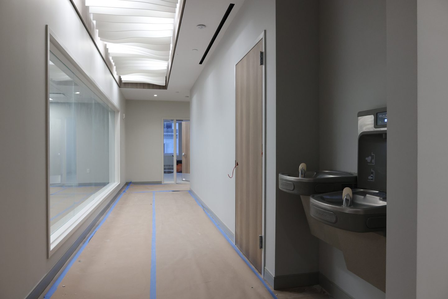 Adelphi Manhattan Center 2025 renovation progress: Unique lighting fixtures; to the right, the STEAM lab.