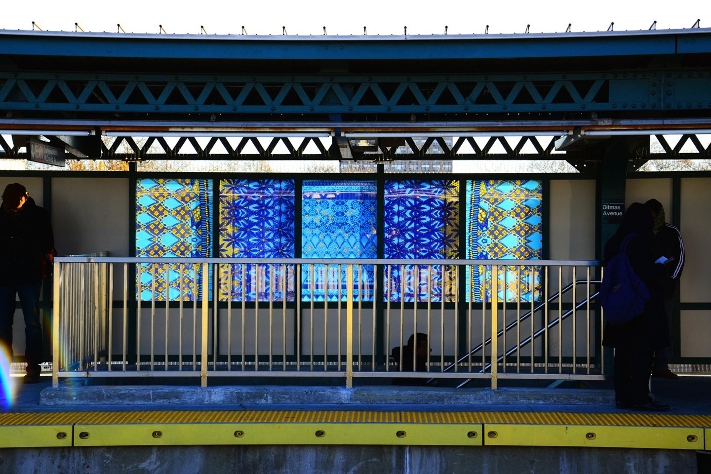 One of the compositions seen from the side, with urban buildings reflected