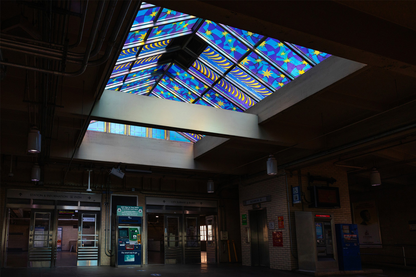 A look at the railroad platform with the blue and purple Jewel Box skylight overhead