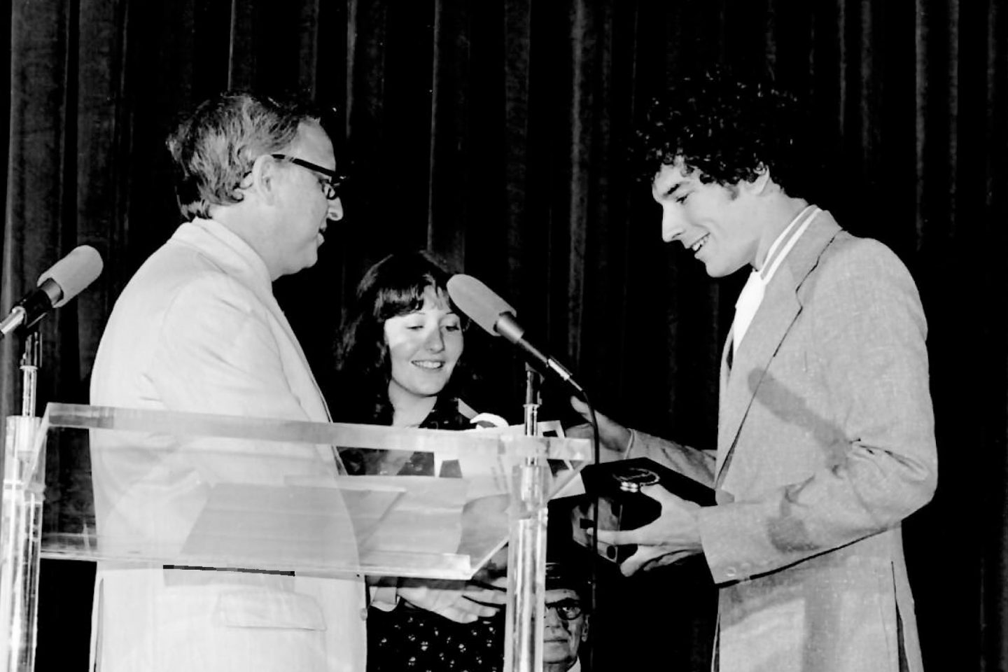 Black and white image from the 1970s of Rich O'Neill '75 and Karen Grossman '76 receive the Student Academy Award in Los Angeles, California for the film titled What The Notes Say
