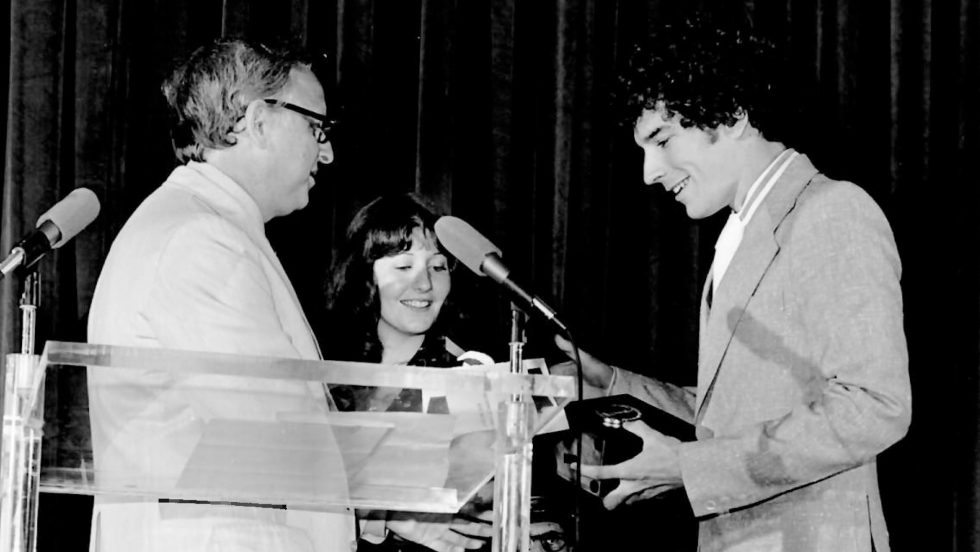 Black and white image from the 1970s of Rich O'Neill '75 and Karen Grossman '76 receiving the Student Academy Award