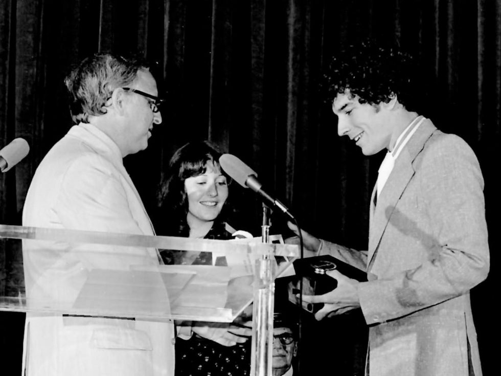 Black and white image from the 1970s of Rich O'Neill '75 and Karen Grossman '76 receiving the Student Academy Award