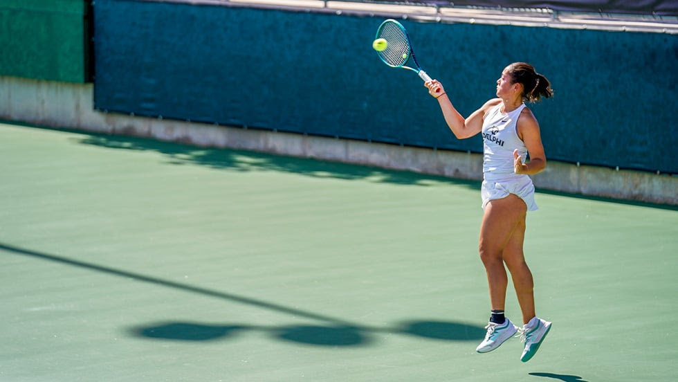 Katarina Liedbeck '26 playing tennis for Adelphi University.