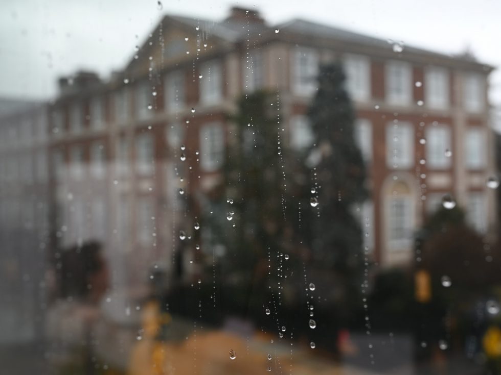 Rain on window looking at Levermore Hall at Adelphi University
