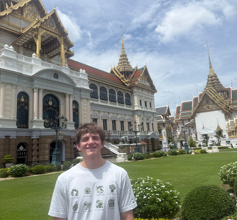 Adelphi student in front of the Grand Palace in Bangkok, Thailand.