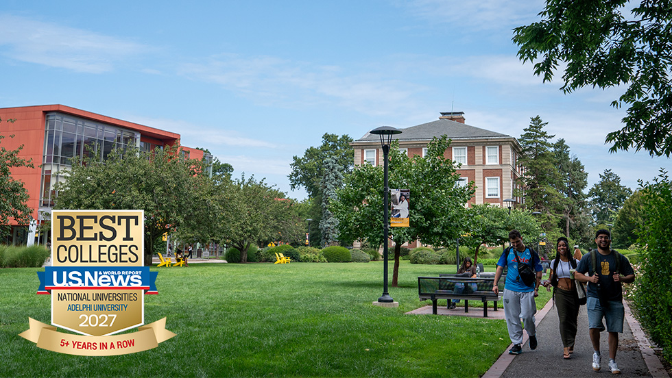 A group of students walking along a path with campus buildings and landscape in the background, including an overlay of a US News & World Report Best Colleges badge in the bottom left corner.