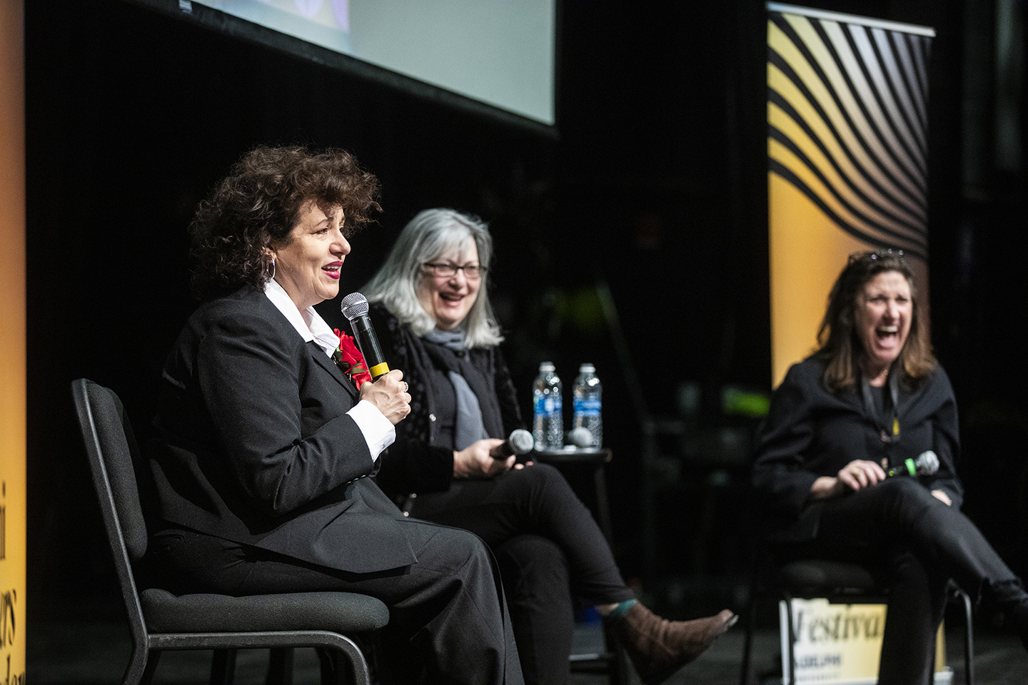 A close-up of the three on stage, taken during the conversation